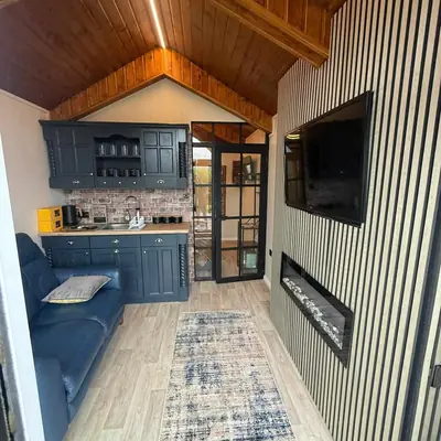 Living room with fireplace in the Cosy Couples' Retreat