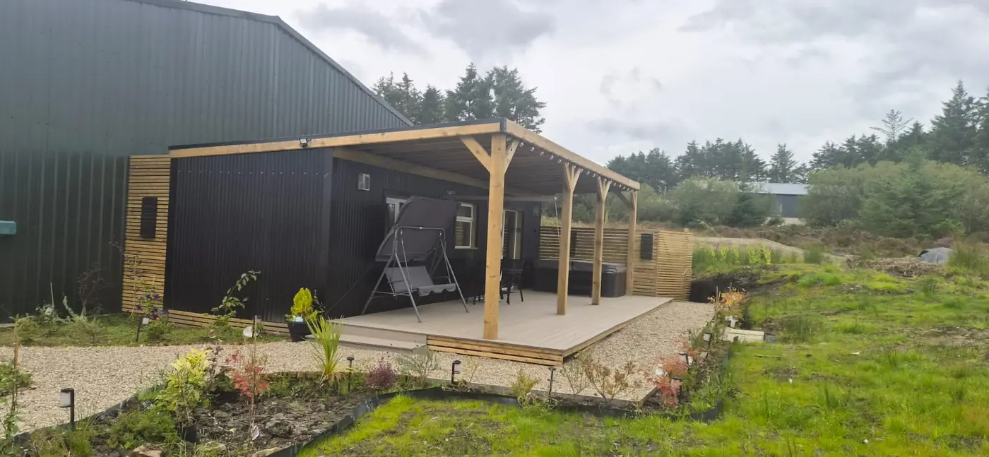 Spacious Family Lodge exterior with covered deck and countryside views