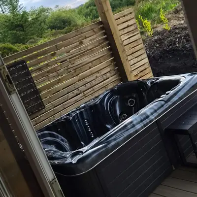 Hot tub with open countryside views at the Spacious Family Lodge